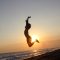 sunset-3305334_1920 Picture of person jumping in air at the beach