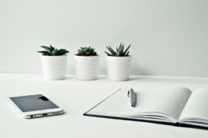 Picture of telephone, desk and note book